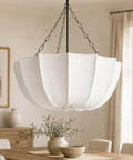 Finktonglan 19.7" White Pleated Fabric Chandelier, Farmhouse Pendant Light for Dining Room hanging over a wooden table.
