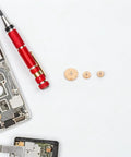 Sturdy 36 Pieces Of Brass Golden Clock Hands And Nuts For Quartz Movement Repair components next to precision screwdriver.
