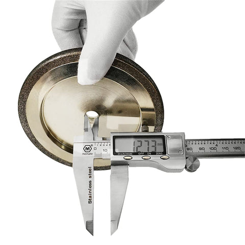 Measuring 5-Inch CBN Bandsaw Grinding Wheel thickness with caliper, designed for 7/8 inch tooth spacing, 10/30° pitch, silver color.