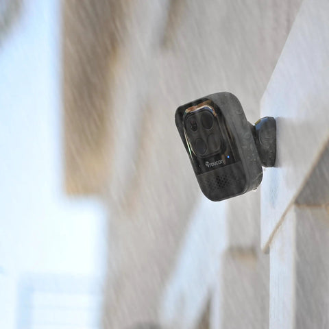 Wireless Outdoor Security Camera 1080P HD Night Vision Motion Detection Weatherproof mounted outside a building in rain
