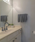 Widespread Matte Black Bathroom Faucet For 3 Hole Sinks 8 Inch Center Spread With Pop Up Drain, installed on cream vanity