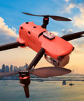 Arc V Pro Grade Multi Color Drone with city skyline and sunset backdrop, 1000 Lumen Output, high visibility lights on drone