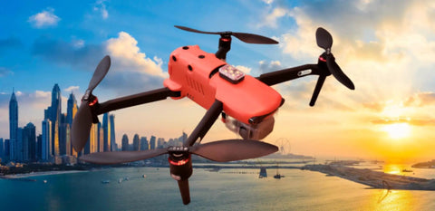 Arc V Pro Grade Multi Color Drone with city skyline and sunset backdrop, 1000 Lumen Output, high visibility lights on drone