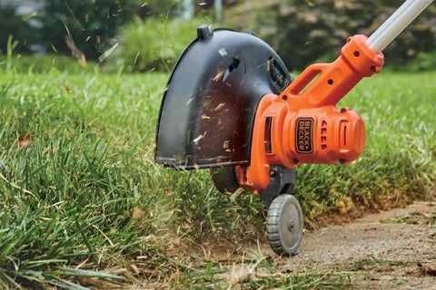 Corded Electric Weed Wacker With 6.5 Amp Motor And 14 Inch Cutting Deck, 2 In 1 Trimmer And Edger For Easy Yard Cleanup, Easyfeed Button To Feed Line, Powerdrive Transmission Powers Through Tough Weeds, Lightweight Yet Beastly Strong trimming grass edges on a lawn