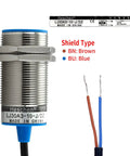 Close-up of Inductive Proximity Sensor Shield Type M30 with wires for magnetic metal detection and automation.