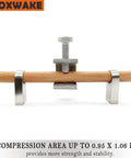 Front view of a Mini C Clamps Stainless Steel 0.83 Inch For Working, clamping a wooden dowel with wide jaw opening and I beam design.