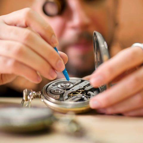Person repairing watch using 100 Pcs Watch Battery Clamp Screws Replacement Micro Screws Kit for watch repair and jewelry tool set.