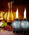 Two crystal gem design glass table torches with citronella, ideal for outdoor patio and garden, providing long burn time up to six hours.