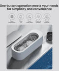 45KHz Ultrasonic Jewelry Cleaner Machine on marble, showing ultrasonic waves cleaning jewelry inside, 360 degree deep cleaning for your bling.