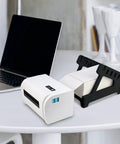 Real Deal Label Roll Organizer Desk Stand For Thermal Printers And Fan Fold Stickers Rack with white printer on desk.