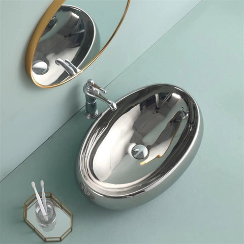 USZWBY Bathroom Vessel Sink European Ceramic Sink Art Basin Chrome Wash Basin Oval Sink Bathroom Sink Washbasin Above Counter Basin with Faucet,Silver Bathro viewed from above with faucet and mirror.
