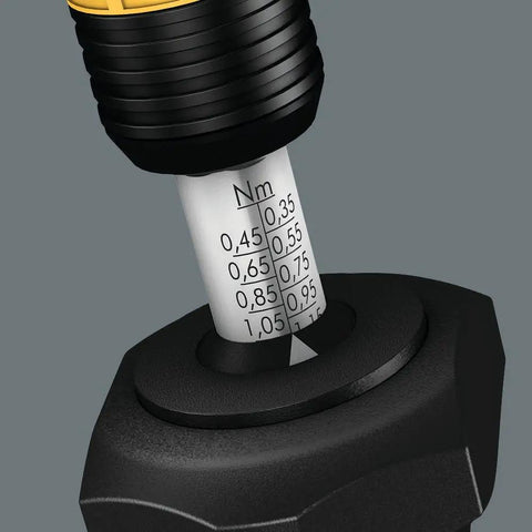 Close-up of adjustable ESD torque screwdriver showing Nm scale, featuring Rapidaptor quick release chuck for electronics work.