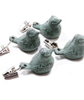 4 Pack Vintage Tablecloth Weights With Clip On Hangers Featuring Rust Proof Green Bird Heavy Duty Cast Iron Windproof Tablecloth Weights To Keep Outdoor Picnics Gardens Weddings And Parties From Flying, displayed on a white background.