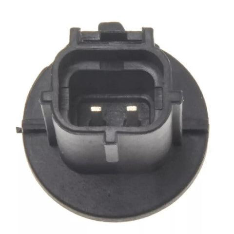 Engine coolant temperature sensor connector, front view, round black plastic housing with two metal pins