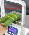 Automatic Omnidirectional Sausage Strapping Machine For Supermarket Vegetables And Food bundling cucumbers with green strap.