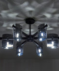 Six Light Black Glass Chandelier Pendant Lighting Mid Century Ceiling Fixture casting light patterns on ceiling