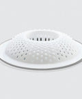 White drain cover hair catcher for shower and bathtub 3 pack that keeps hair out and prevents clogs while letting water flow freely.