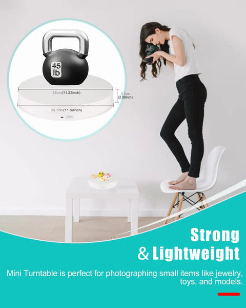 12 Inch Motorized Rotating Turntable Display Stand With 360 Degree Spin For Product Photography shows a woman photographing a kettlebell.