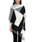Black And White Piano Grid Winter Scarf Crafted From Plush Faux Cashmere With Extended Fringe Edges draped on model, perfect for chilly days.