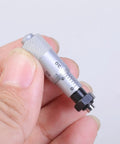 Hand holding 0 To 6.5 Inches Carbon Steel Micrometer Head Workhorse Gauge For Engineers with flat needle and plain thimble