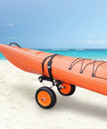Foldable Aluminum Kayak Cart With 250 Lb Load Capacity And 10 Inch Solid Wheel Dolly transporting orange kayak on sandy beach