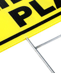 Close-up of yellow Slow Down Kids At Play Signs With Metal Stakes Four Pack 12 By 16 Inch Double Sided Caution Signs corner view