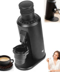 Powerhouse Single Dose Espresso Grinder With 80mm Stainless Steel Flat Burrs Producing Crisp Uniform Grinds Stepless Dial Delivers Legit Control Over Every Perfect Shot Brushless Motor Silver, shown from an angle with a cup of coffee.