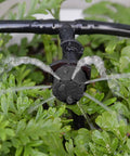 Close-up of 100 Pcs Adjustable Drip Irrigation Emitters Sprinklers For One Quarter Inch Barbed Hose Micro Drip System in use
