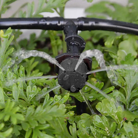 Close-up of 100 Pcs Adjustable Drip Irrigation Emitters Sprinklers For One Quarter Inch Barbed Hose Micro Drip System in use