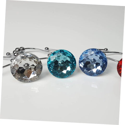 Close-up of colorful crystal-accented 12 Pack Glide Shower Ring Hooks for Curtain and Liner on a smooth white surface