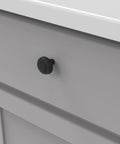 Heavy Duty Solid Metal Core Cabinet Knobs 10 Pack Black Iron One And One Quarter Inch Hardware for white drawer front view.