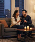 Couple in living room with Vintage Tripod Floor Lamp With Nautical Vibe And Dope Rustic Industrial Finish In Steel Aluminum And Brown Wood