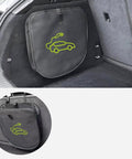 Keep Your Setup Tight With This Roll Out Ready EV Cable Tote visible in car trunk, gray fabric, ideal for organizing charging cables.