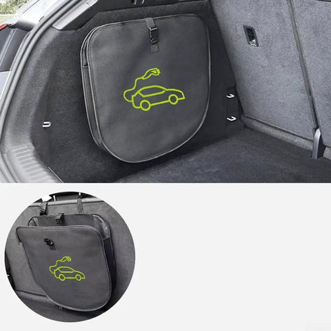 Keep Your Setup Tight With This Roll Out Ready EV Cable Tote visible in car trunk, gray fabric, ideal for organizing charging cables.