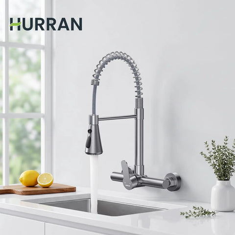 Hurran Wall Mount Kitchen Faucet, Commercial Utility Sink Faucet with flexible spring sprayer and water stream in kitchen setting.