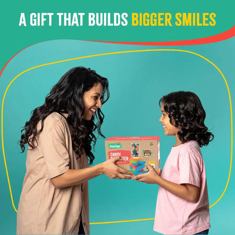 Child receiving Candy Dispenser Woodworking Kit For Kids A Hands On STEM Building Project With FSC Certified Wood Paints And Tools Includes DIY Gumball Machine Craft For Boys And Girls Ages Six And Up kit.