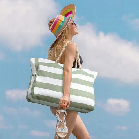 Woman carrying Ultra Roomy Waterproof Beach Tote For Women With Secure Zipper Closure Large Sandproof Swim Pool Bag on a sunny day