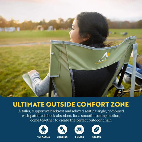 Woman sitting in Comfort Pro Rocker Folding Outdoor Chair For Camping And Backyard Hangouts, enjoying a scenic view.