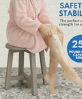 Person shaving legs seated on CoastalVogue 12 Inch Teak Shower Stool Round Gray Waterproof Bath Bench For Inside Shower