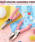 Heart Shaped Paper Punch Handheld Perforator with pink soft grip handles on a colorful DIY craft background.
