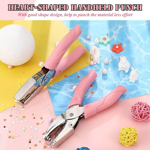 Heart Shaped Paper Punch Handheld Perforator with pink soft grip handles on a colorful DIY craft background.