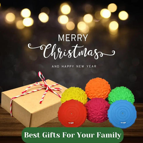 Hedgehog Balance Pods Set Of 6 In Multiple Colors beside a gift box for Christmas, with festive lights in the background.