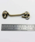 Stainless Steel Hook And Eye Latch 4.72 Inch Gate Latch Privacy Lock with ruler for scale in antique bronze finish.