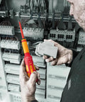 Technician using 7516 VDE Kraftform Safe Torque Speed Torque Screwdriver for circuit installation, ensuring precision.
