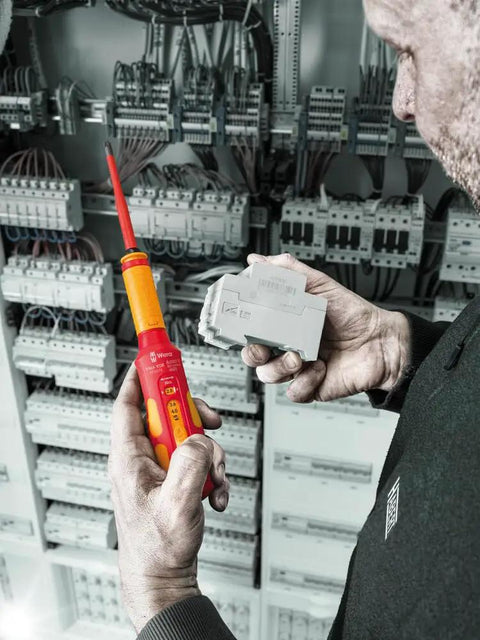 Technician using 7516 VDE Kraftform Safe Torque Speed Torque Screwdriver for circuit installation, ensuring precision.