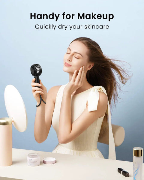 Woman using Mini Portable Handheld Fan With 3 Speeds USB Rechargeable Personal Fan for Makeup