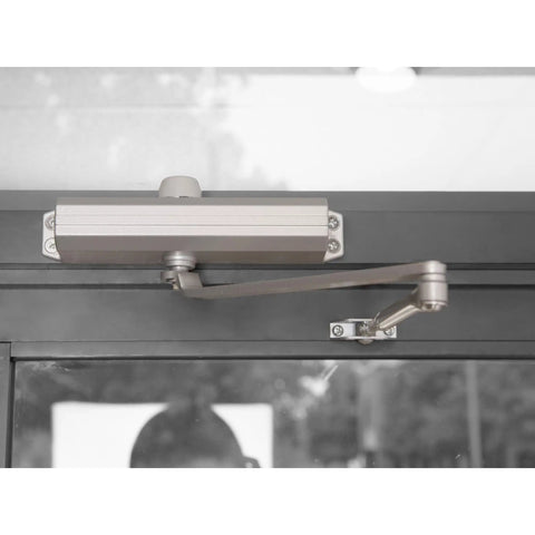 Compact Workhorse Door Closer With Adjustable Spring Tension And Aluminum Finish ADA Ready Non Handed Reversible on door
