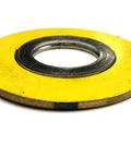 Top view of a spiral-wound gasket with yellow outer ring and metal inner coil