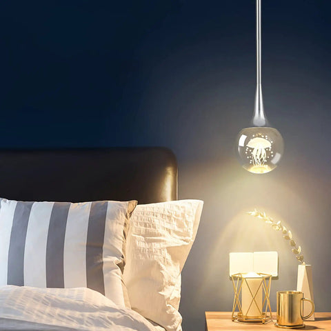 Mini Pendant Light With Dope Teardrop Crystal Jellyfish Pattern, Chrome Finish, 5W Globe LED Hanging Light in bedroom setting.