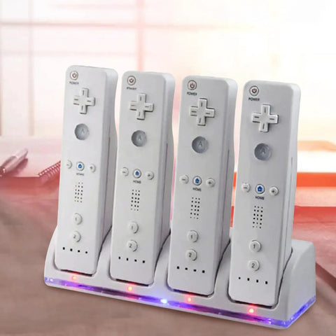 4 In 1 Battery Charging Station For Wii And Wii U Remotes With 4 Rechargeable Battery Packs And USB Cable No More Dead Batteries Fast Charge Easy Swap Keeps Your Game Time Rolling Controllers Not Included, showing four white slots with LED indicators and remotes.